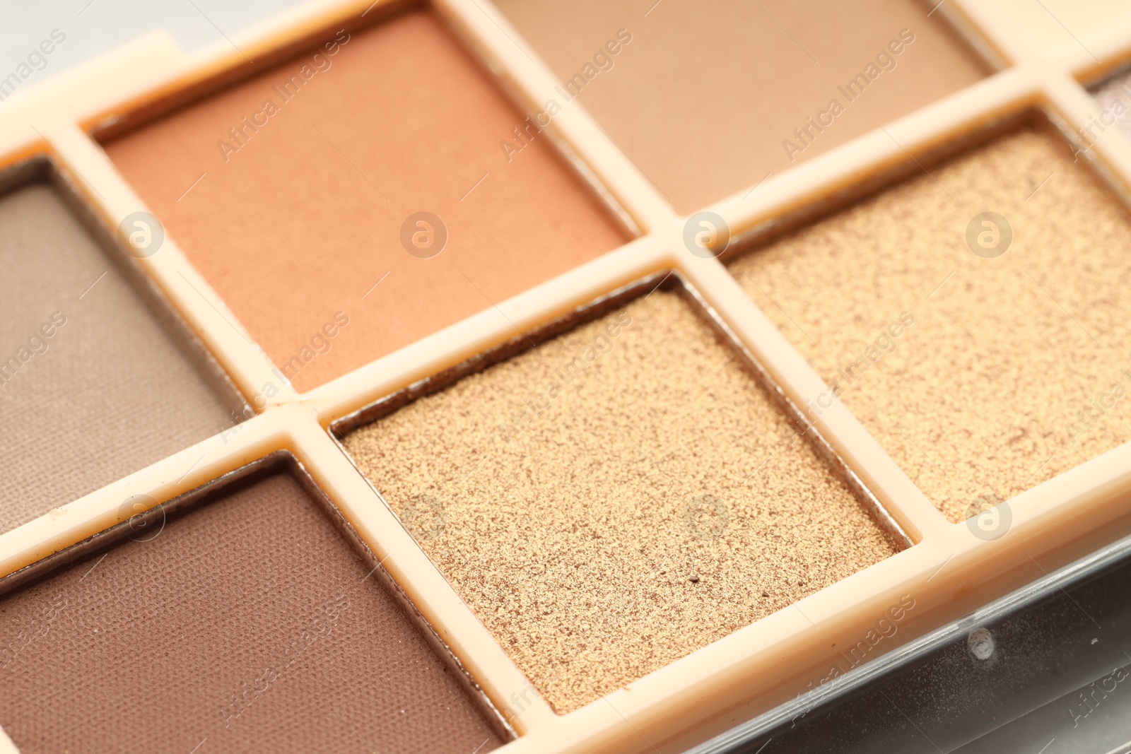 Photo of Beautiful eyeshadow palette as background, closeup. Cosmetic product
