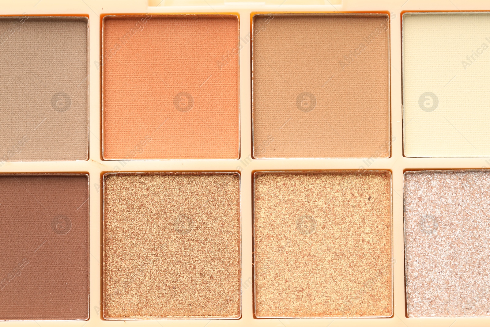 Beautiful eyeshadow palette as background, top view Photo of Beautiful eyeshadow palette as background, top view