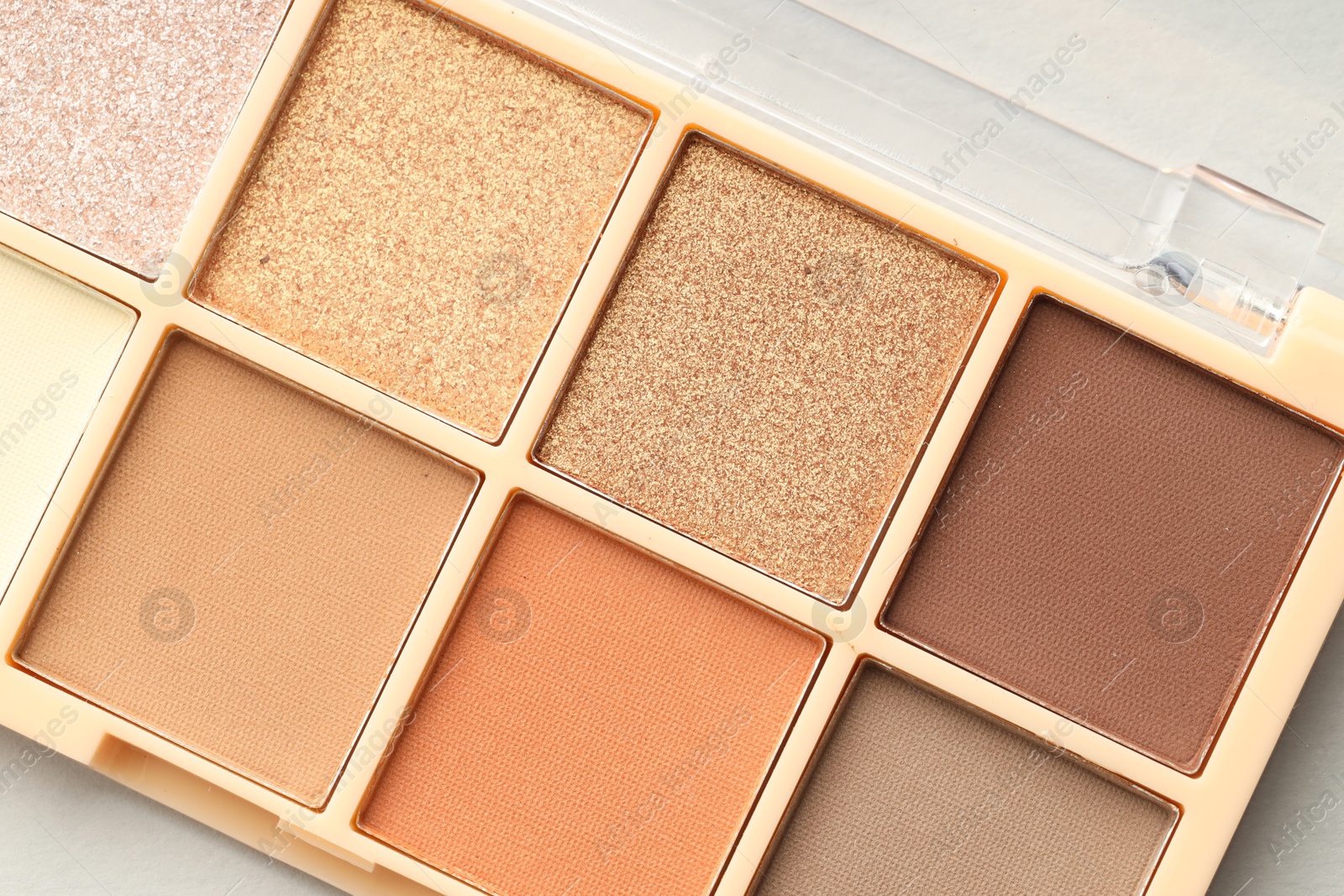 Photo of Beautiful eyeshadow palette on white background, top view