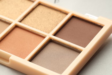 Photo of Beautiful eyeshadow palette on white background, closeup