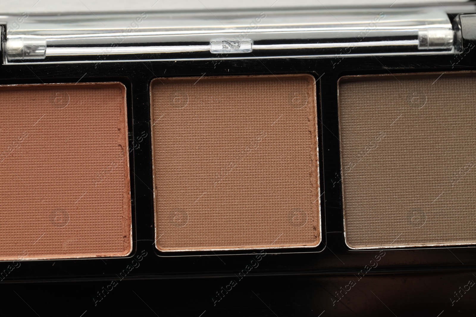 Beautiful eyeshadow palette as background, top view Photo of Beautiful eyeshadow palette as background, top view