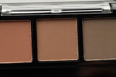 Photo of Beautiful eyeshadow palette as background, top view