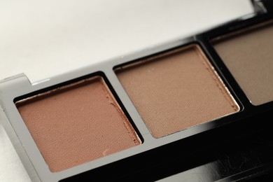 Photo of Beautiful eyeshadow palette on white background, closeup