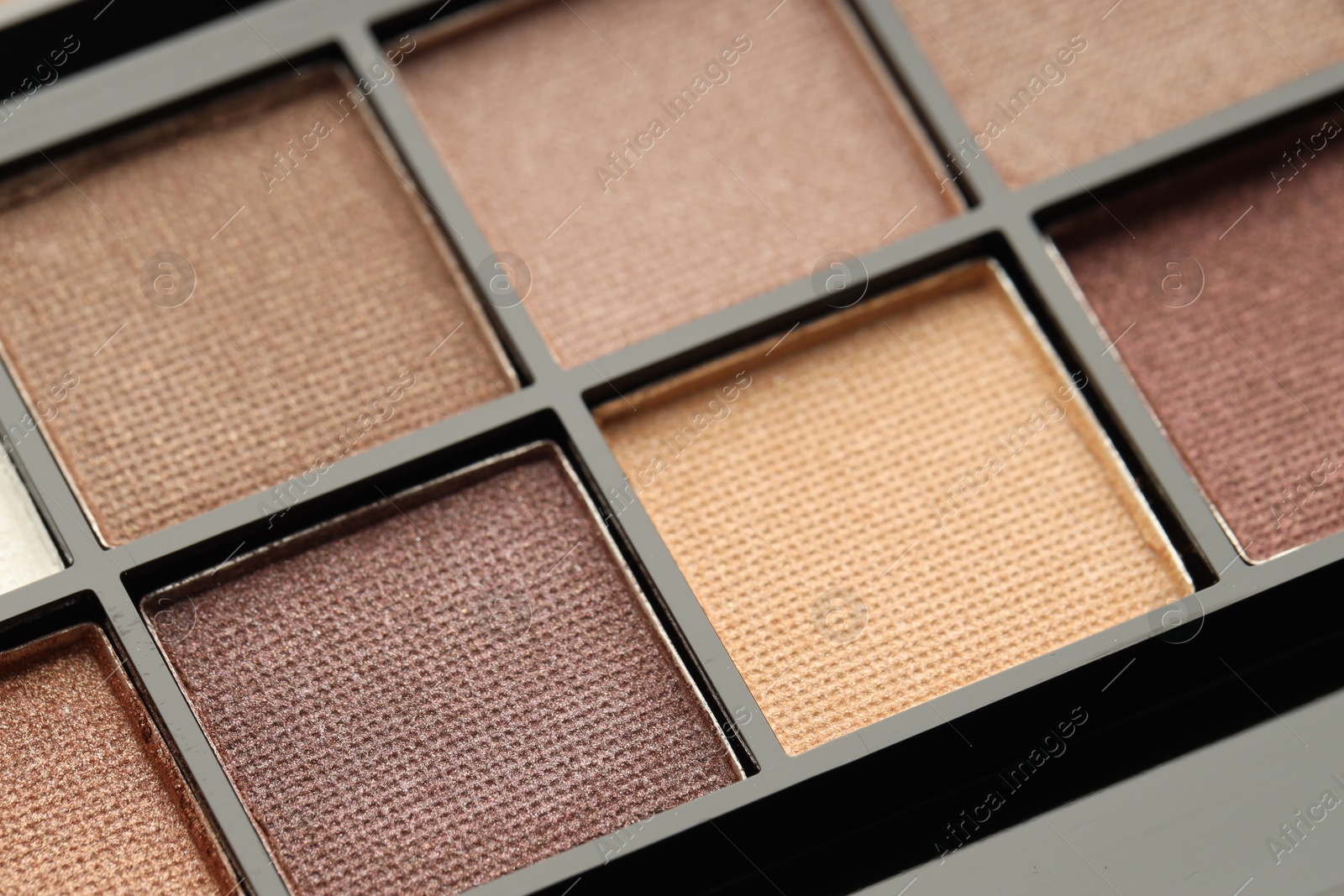 Photo of Beautiful eyeshadow palette as background, closeup. Cosmetic product