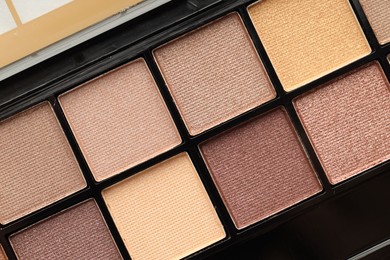 Photo of Beautiful eyeshadow palette as background, top view