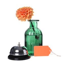 Photo of Blank card, desk bell and vase with flower isolated on white
