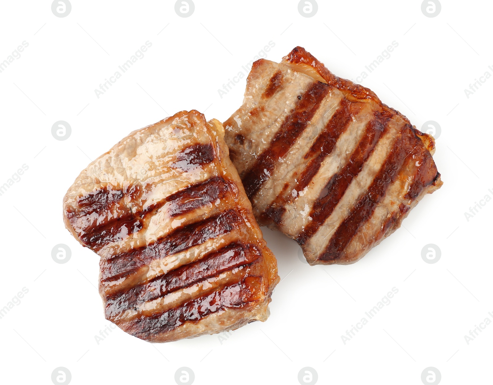 Steaks of delicious grilled beef meat isolated on white, top view Photo of Steaks of delicious grilled beef meat isolated on white, top view