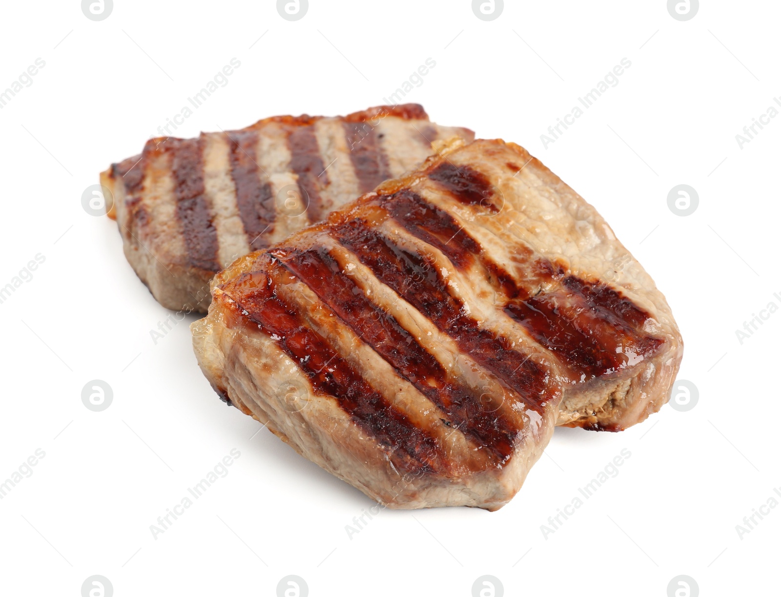 Steaks of delicious grilled beef meat isolated on white Photo of Steaks of delicious grilled beef meat isolated on white