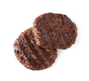 Photo of Delicious grilled beef patties isolated on white, top view