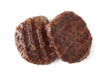 Photo of Delicious grilled beef patties isolated on white, top view