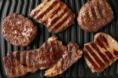 Photo of Electric grill with delicious beef meat, top view