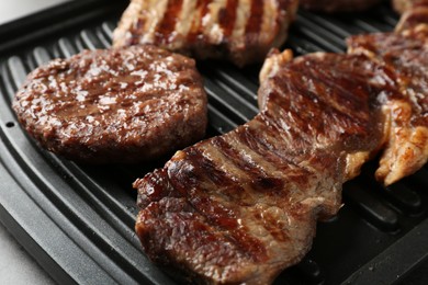 Photo of Delicious grilled beef meat on table, closeup