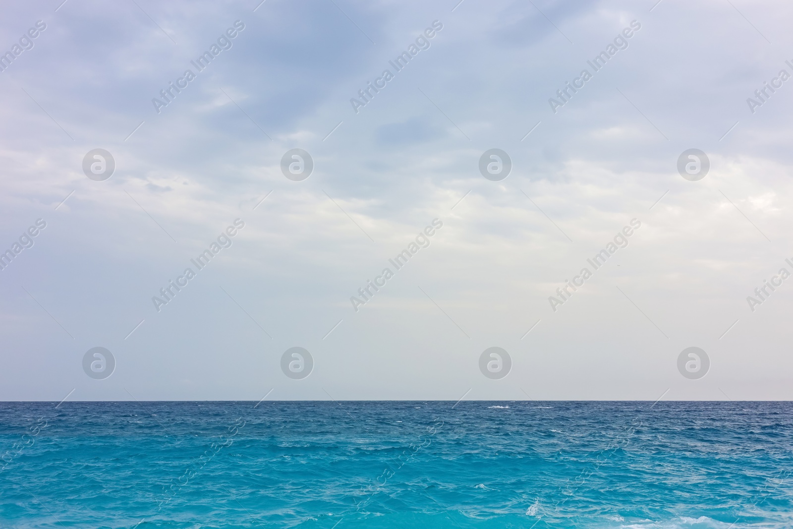 Photo of Beautiful view of wavy sea and pebbles on beach