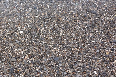Photo of Many beautiful pebbles as background, top view