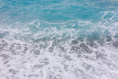Photo of Beautiful view of wavy sea and pebbles on beach