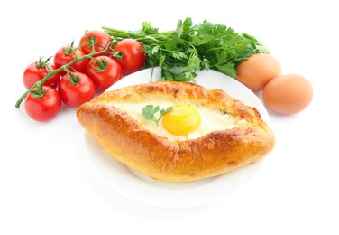 Photo of Tasty khachapuri with eggs, tomatoes and parsley isolated on white
