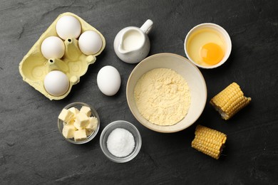 Photo of Cornbread preparation. Different ingredients on black textured table, flat lay