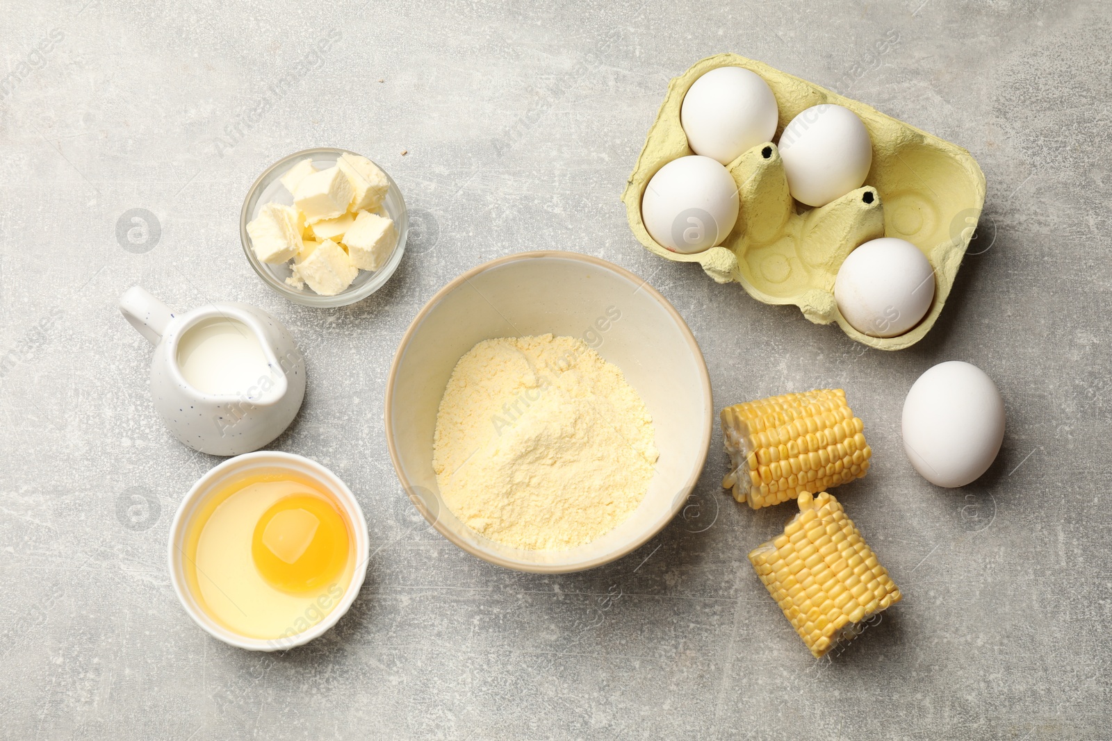 Photo of Cornbread preparation. Different ingredients on light grey table, flat lay