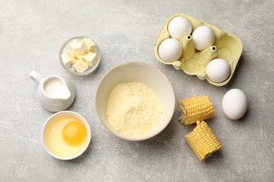 Photo of Cornbread preparation. Different ingredients on light grey table, flat lay