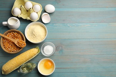Photo of Cornbread preparation. Different ingredients on light blue wooden table, flat lay. Space for text