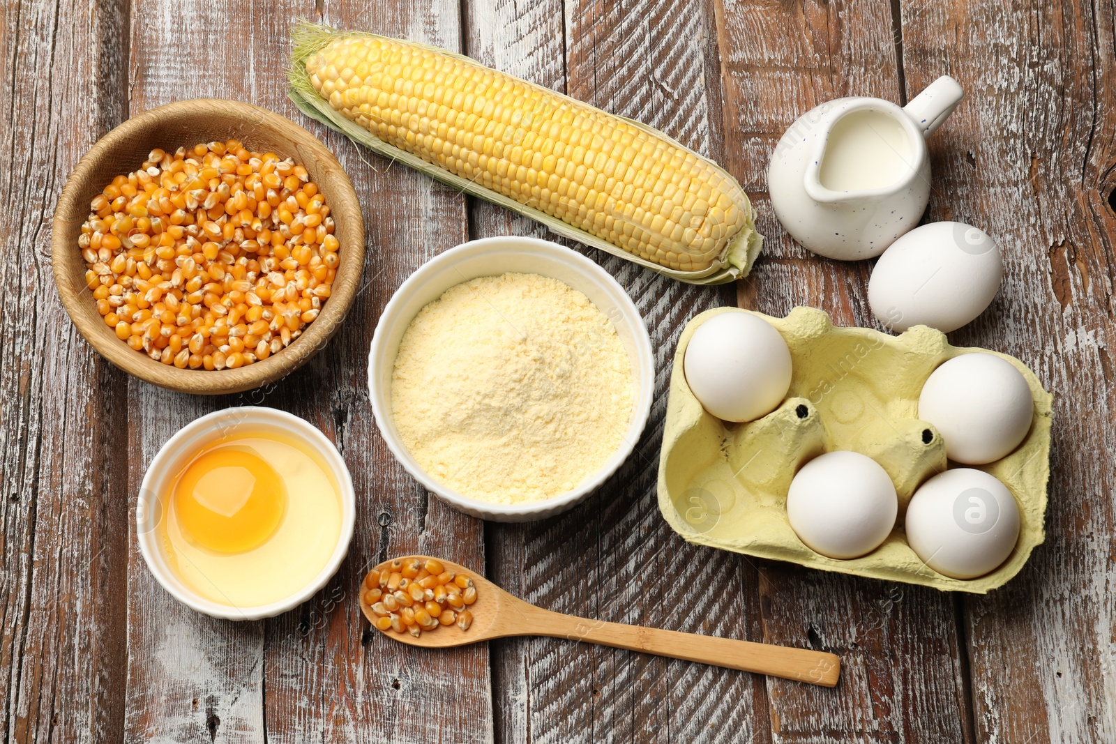 Cornbread preparation. Different ingredients on wooden table, flat lay Photo of Cornbread preparation. Different ingredients on wooden table, flat lay