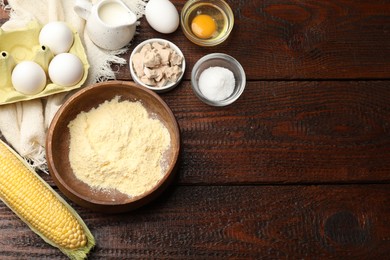Photo of Cornbread preparation. Different ingredients on wooden table, flat lay. Space for text