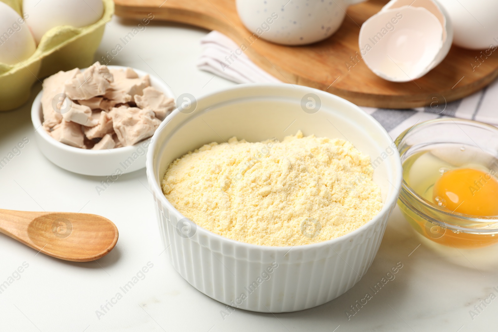 Making cornbread. Different ingredients on white marble table, closeup Photo of Making cornbread. Different ingredients on white marble table, closeup