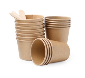 Photo of Set of disposable cups and wooden sticks isolated on white