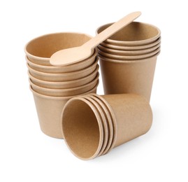 Photo of Set of disposable cups and wooden spoon isolated on white