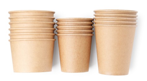 Photo of Set of disposable cups isolated on white, top view