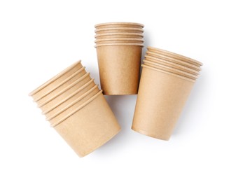 Photo of Set of disposable cups isolated on white, top view