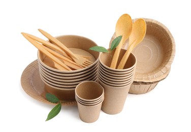Photo of Set of disposable tableware and leaves isolated on white