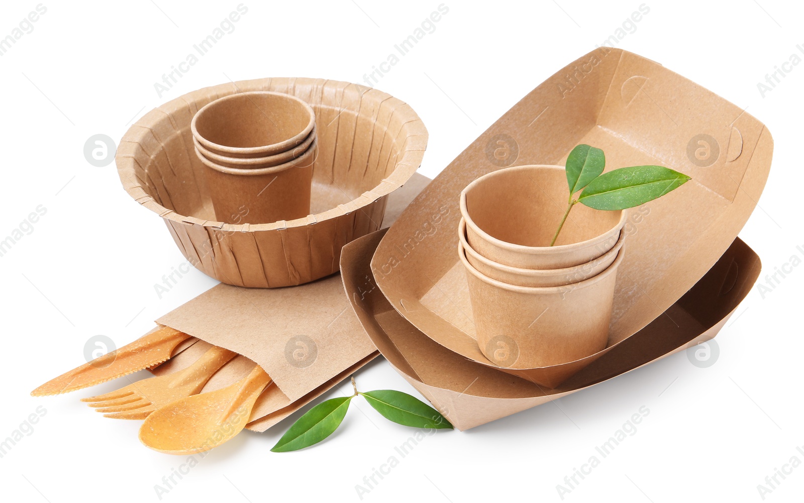 Photo of Set of disposable tableware and leaves isolated on white