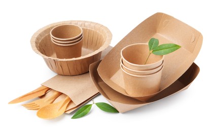 Photo of Set of disposable tableware and leaves isolated on white