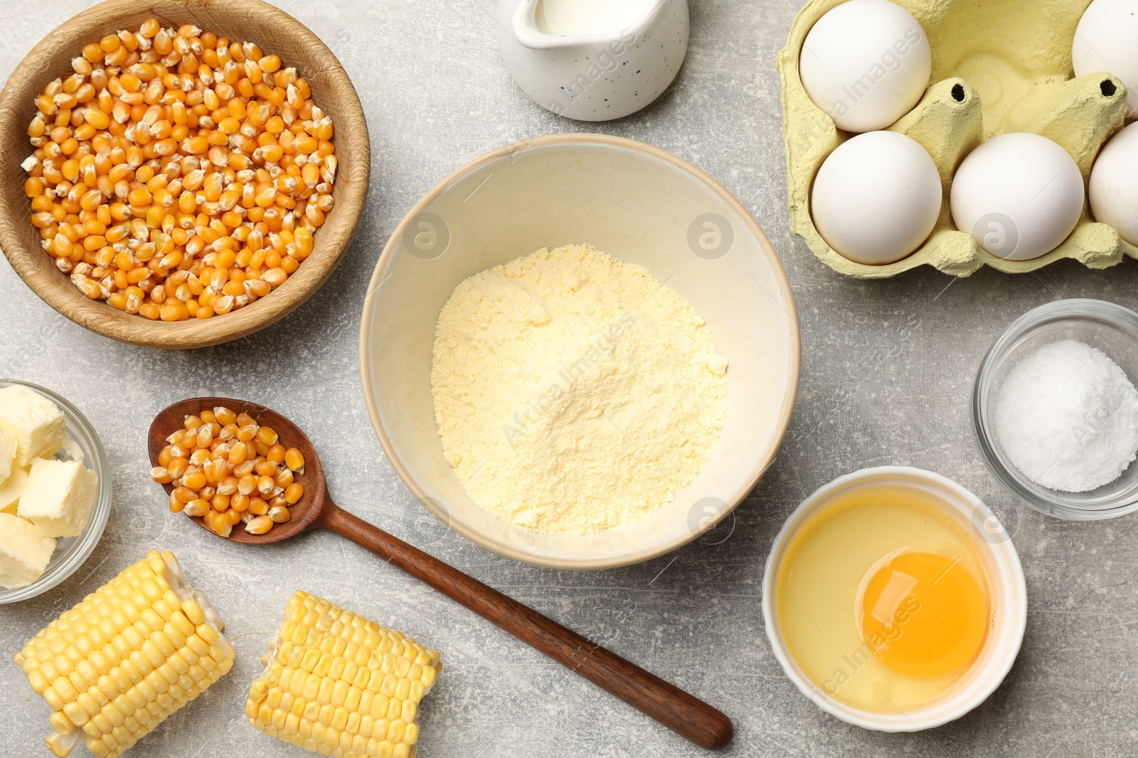 Photo of Cornbread preparation. Different ingredients on light grey table, flat lay