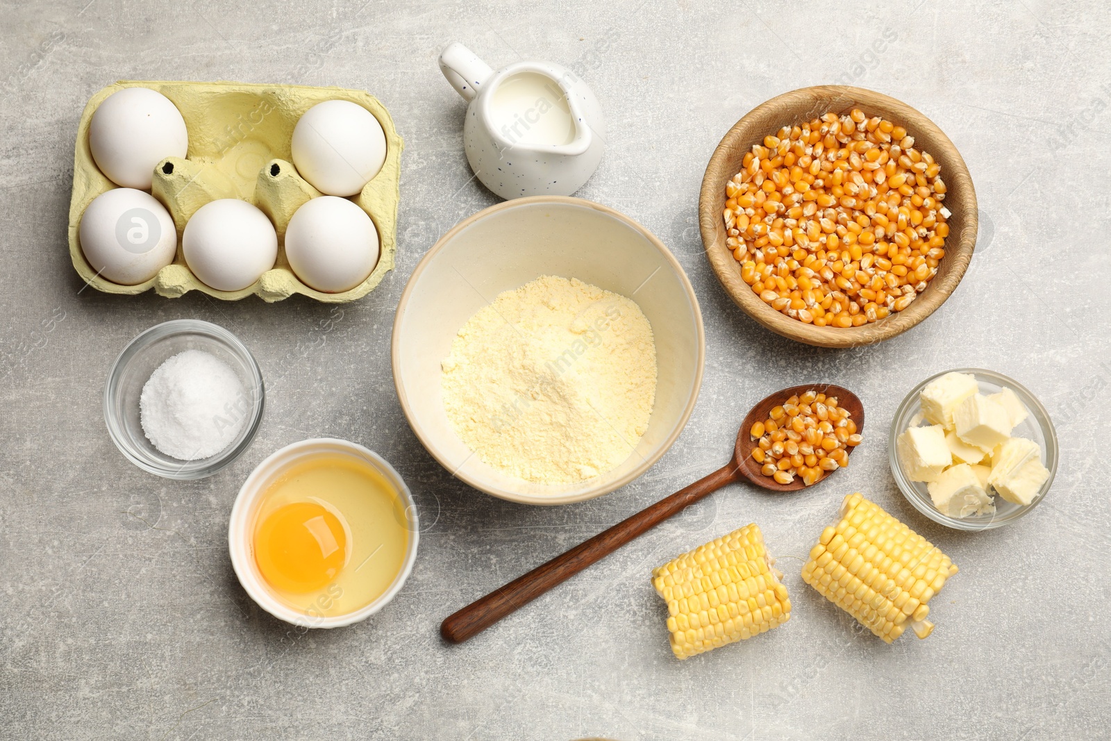 Photo of Cornbread preparation. Different ingredients on light grey table, flat lay