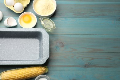 Photo of Cornbread preparation. Different ingredients and baking dish on light blue wooden table, flat lay. Space for text