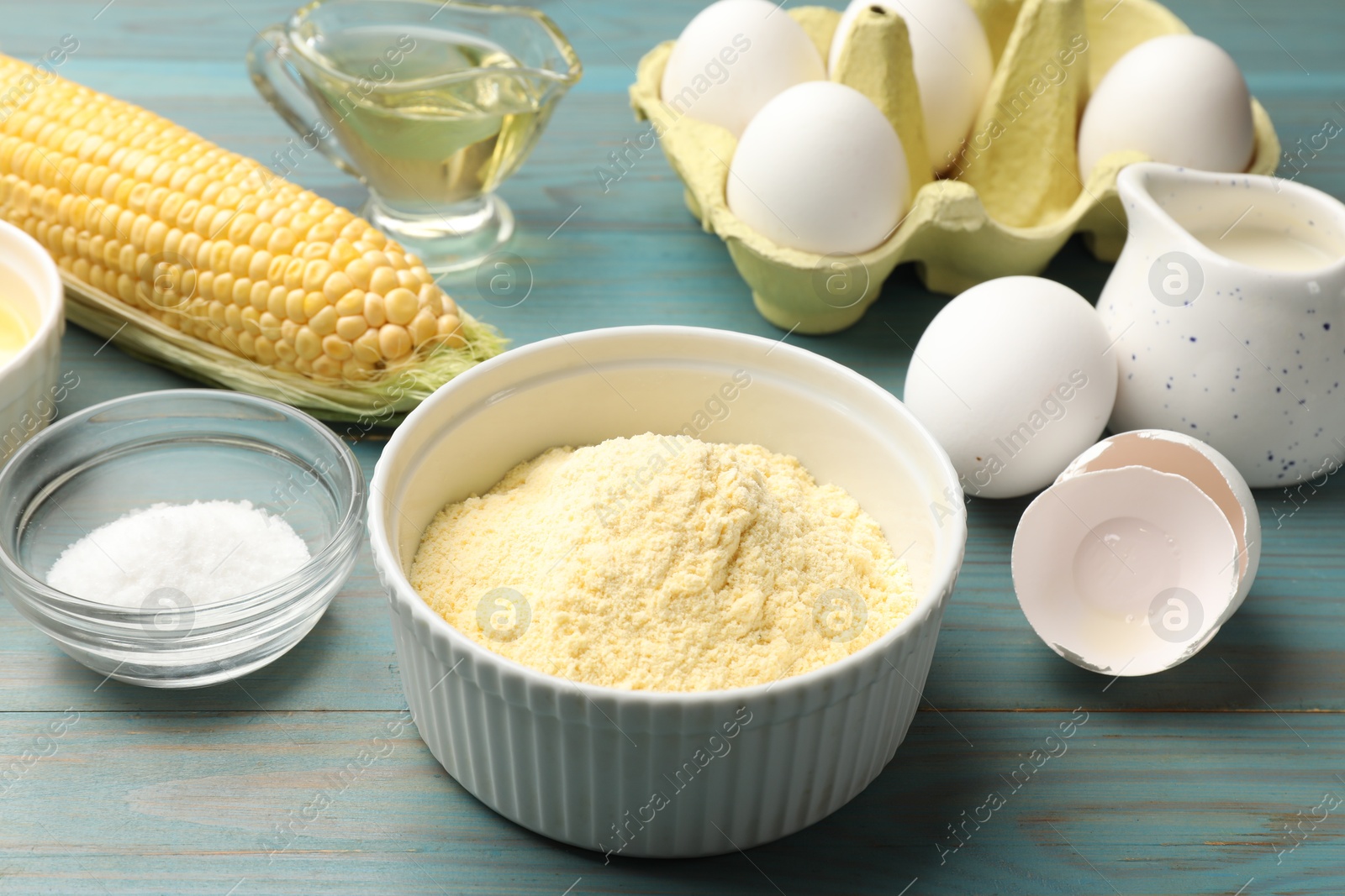 Making cornbread. Different ingredients on light blue wooden table, closeup Photo of Making cornbread. Different ingredients on light blue wooden table, closeup