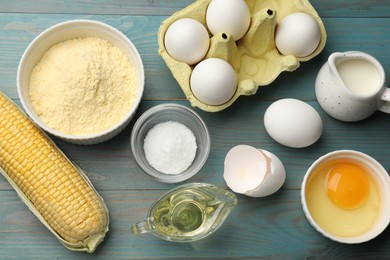 Photo of Cornbread preparation. Different ingredients on light blue wooden table, flat lay