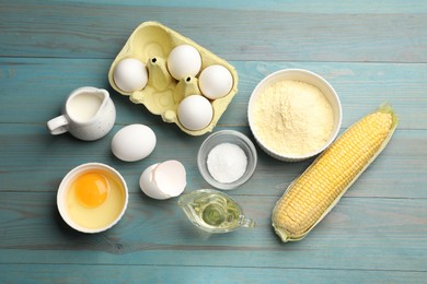 Photo of Cornbread preparation. Different ingredients on light blue wooden table, flat lay