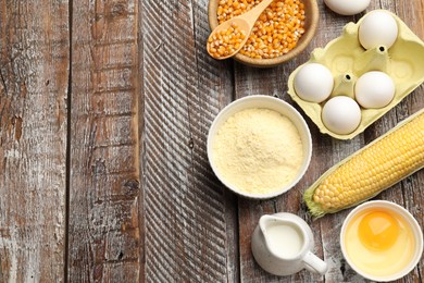 Photo of Cornbread preparation. Different ingredients on wooden table, flat lay. Space for text
