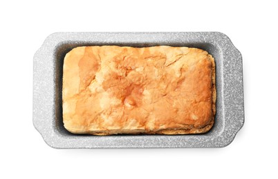 Photo of Freshly baked cornbread in baking dish isolated on white, top view