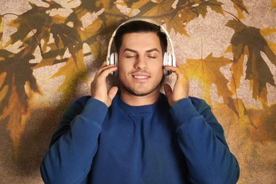 Image of Happy man listening to sounds of nature which making him feel calm. Double exposure of carpet and tree branch