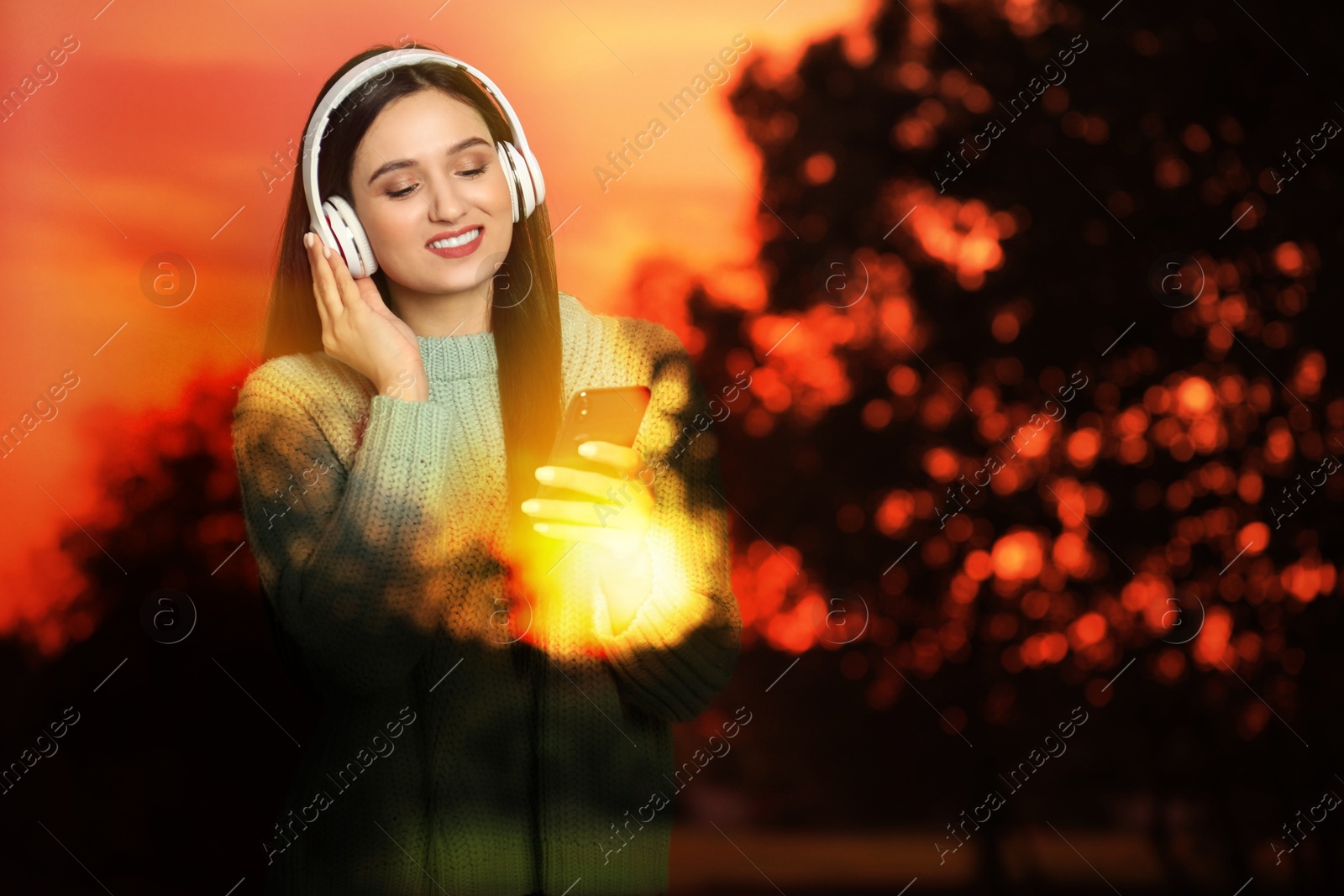 Image of Woman listening to sounds of nature which making her feel calm. Double exposure with landscape
