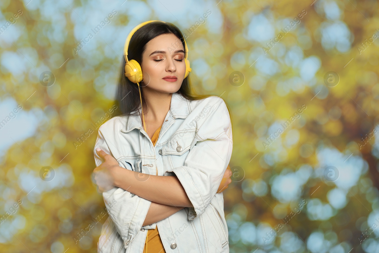 Image of Woman listening to sounds of nature which making her feel calm. Double exposure with tree