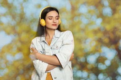 Image of Woman listening to sounds of nature which making her feel calm. Double exposure with tree