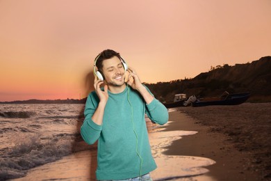 Image of Happy man listening to sounds of nature which making him feel calm. Beautiful seascape on background