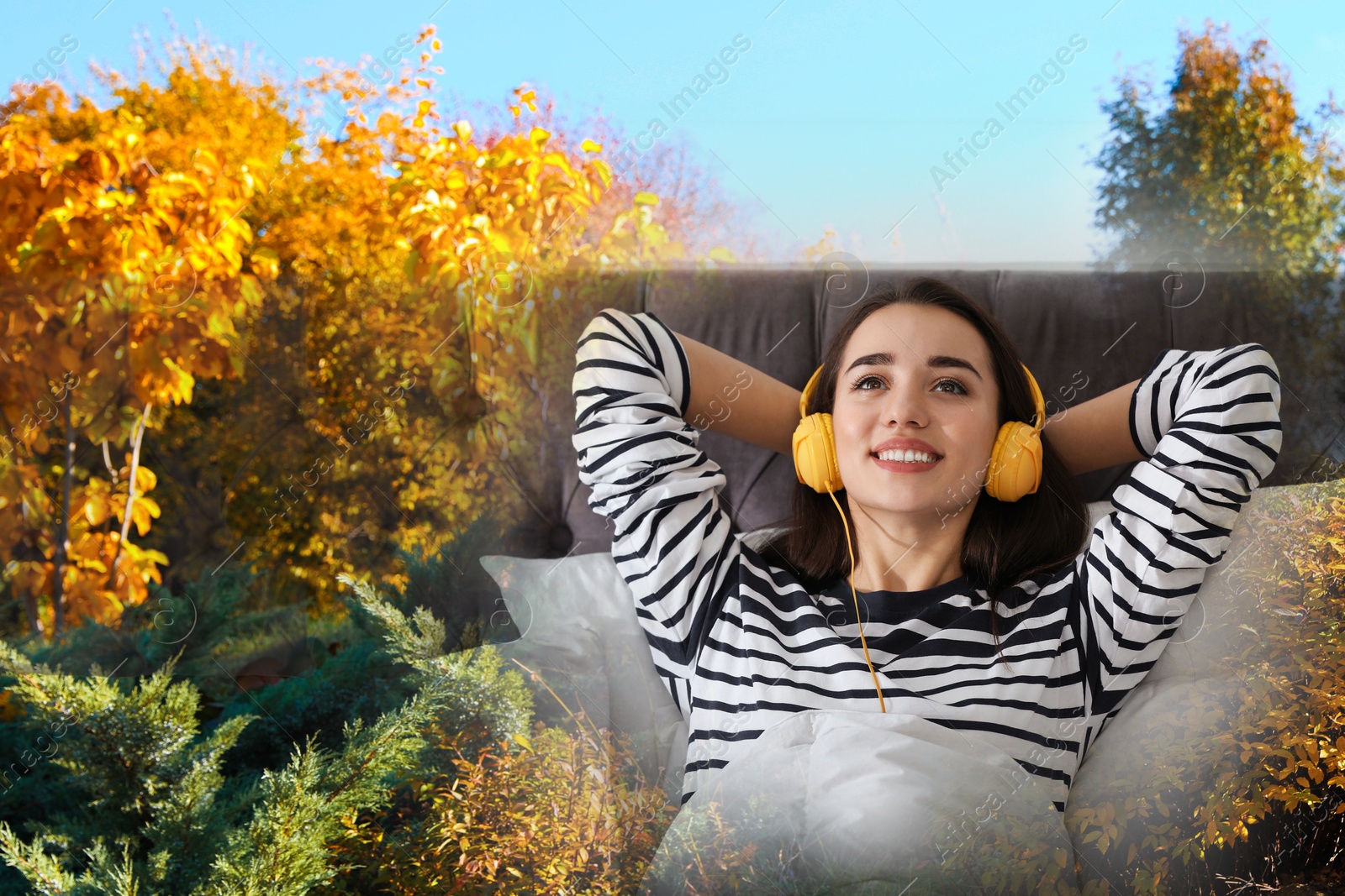 Image of Happy woman listening to sounds of nature which making her feel calm. Double exposure of bedroom and autumn landscape