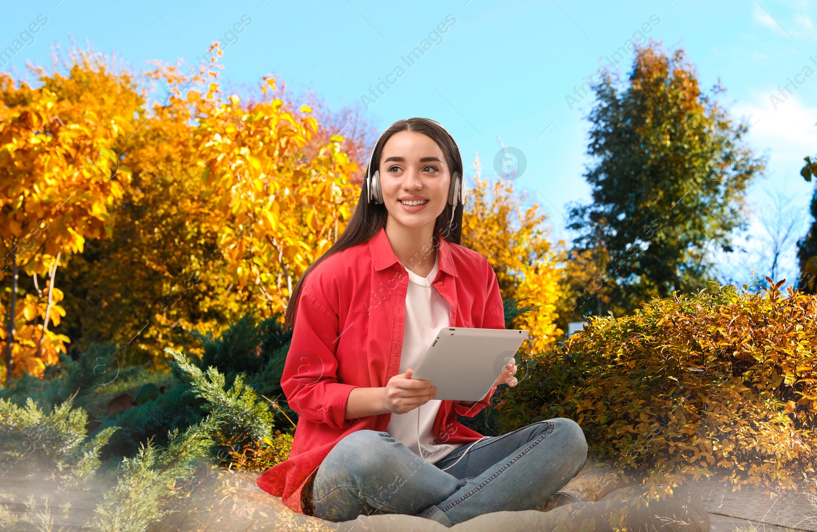 Image of Happy woman listening to sounds of nature which making her feel calm. Double exposure with autumn landscape