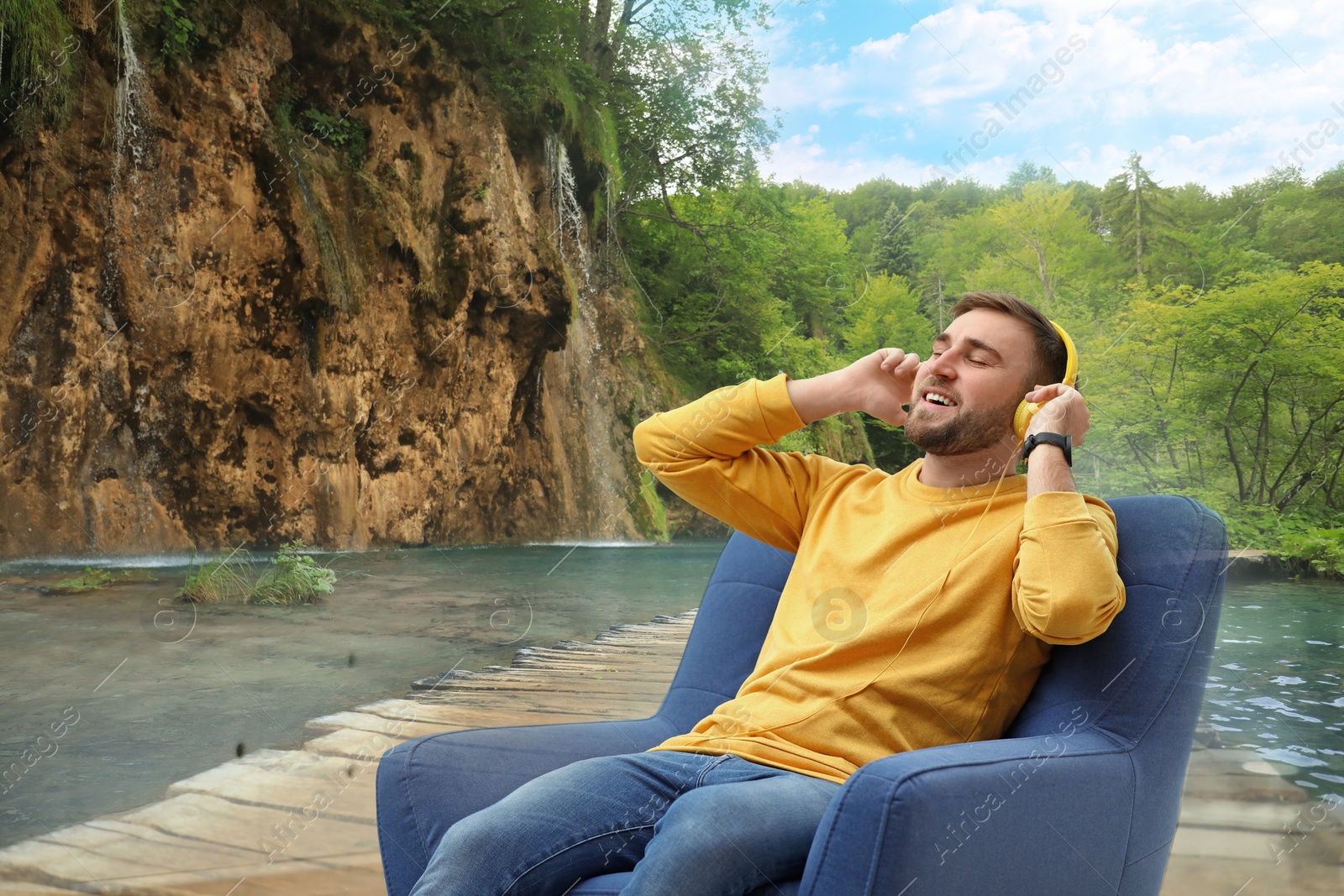 Image of Happy man listening to sounds of nature which making him feel calm. Double exposure of with beautiful landscape